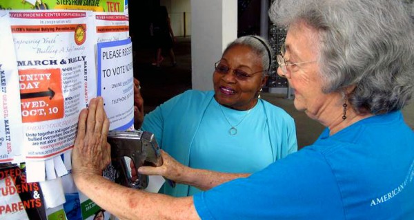 AAUW members in Florida post get out the vote posters in their community.